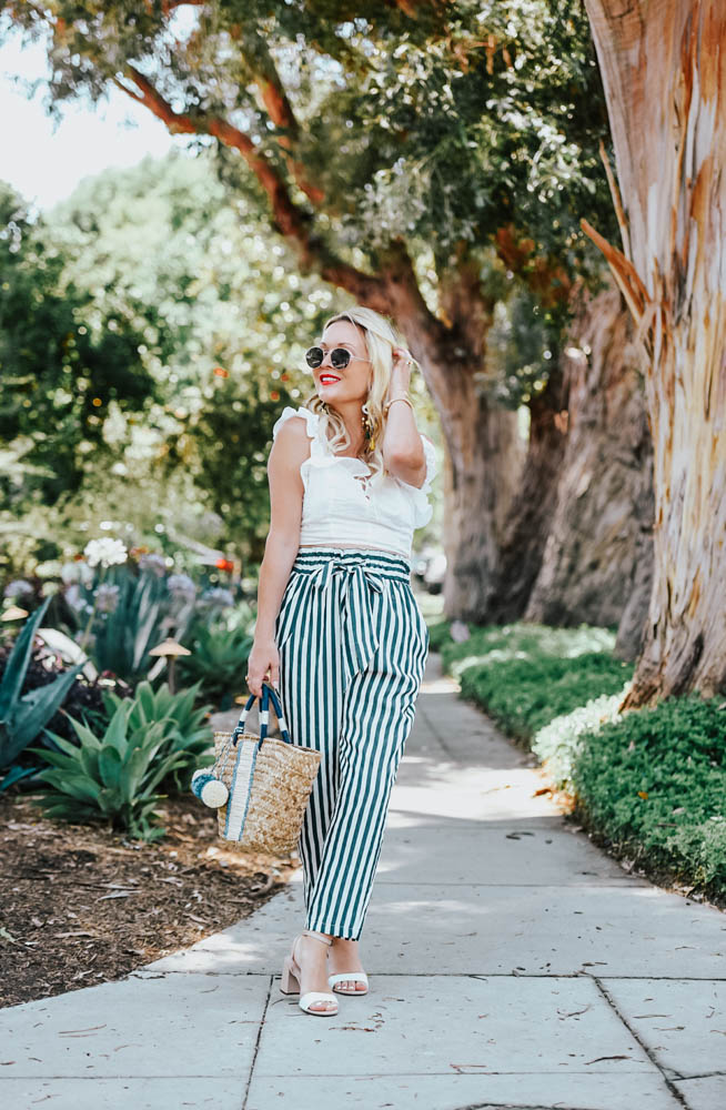 Zara Striped Pants, Eyelet Top, Straw Bag featured by popular Los Angeles fashion blogger The Hunter Collector 