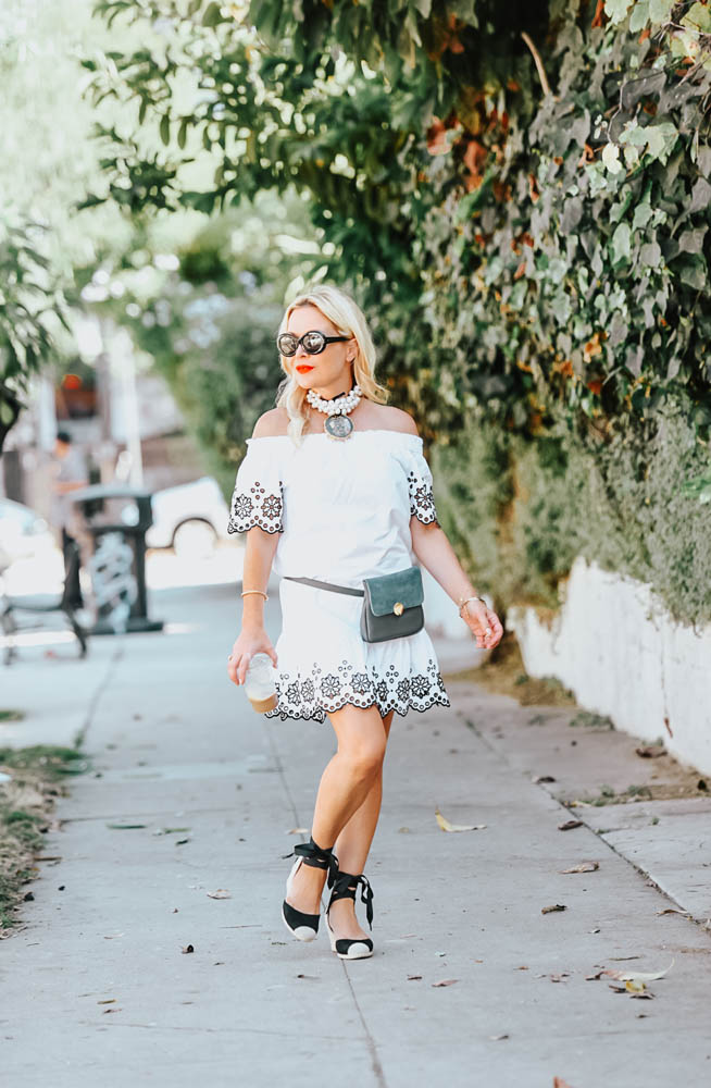 White Eyelet Dress, Belt Bag featured by popular Los Angeles fashion blogger The Hunter Collector